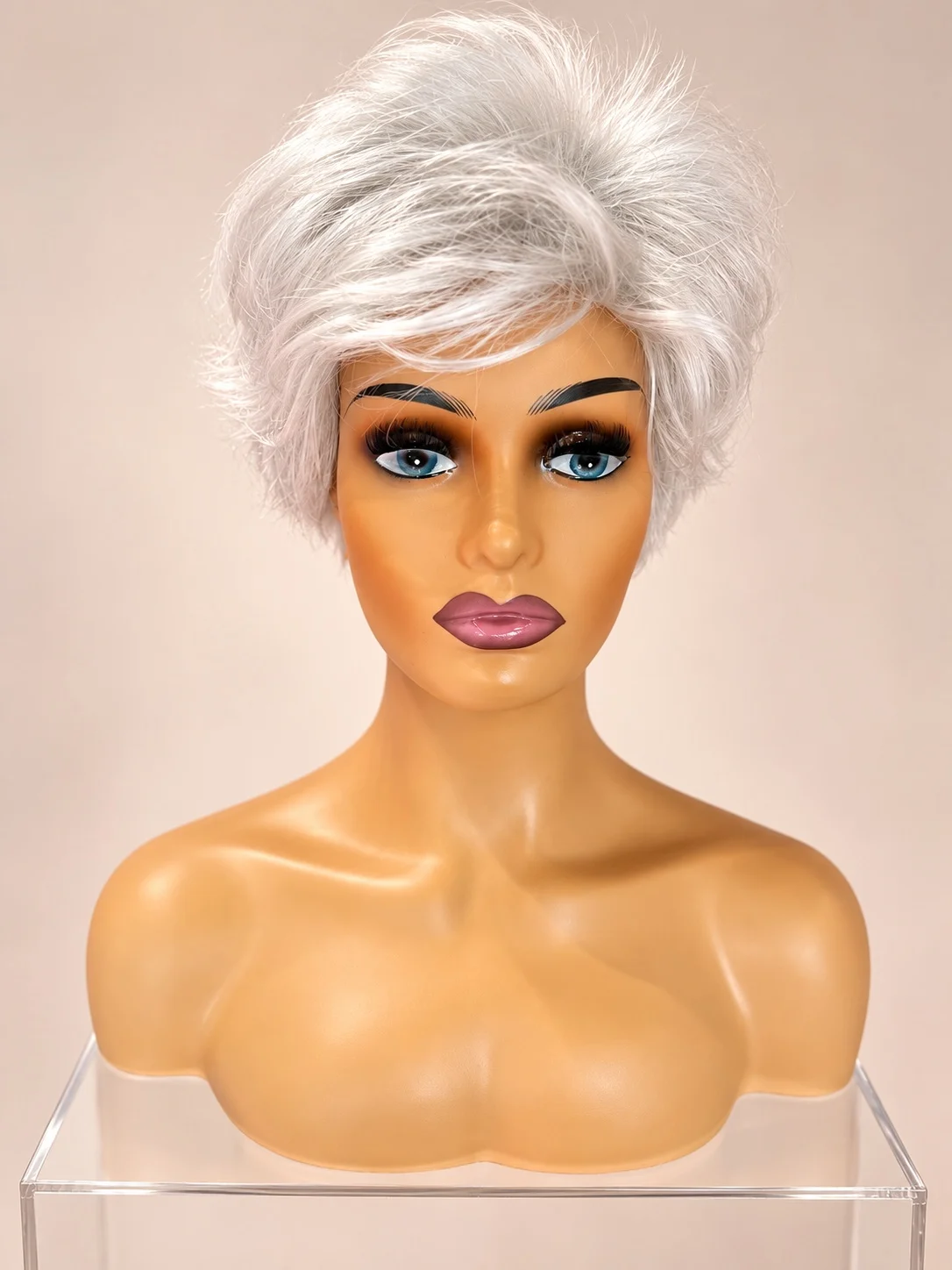 A short silver wig with softly layered styling